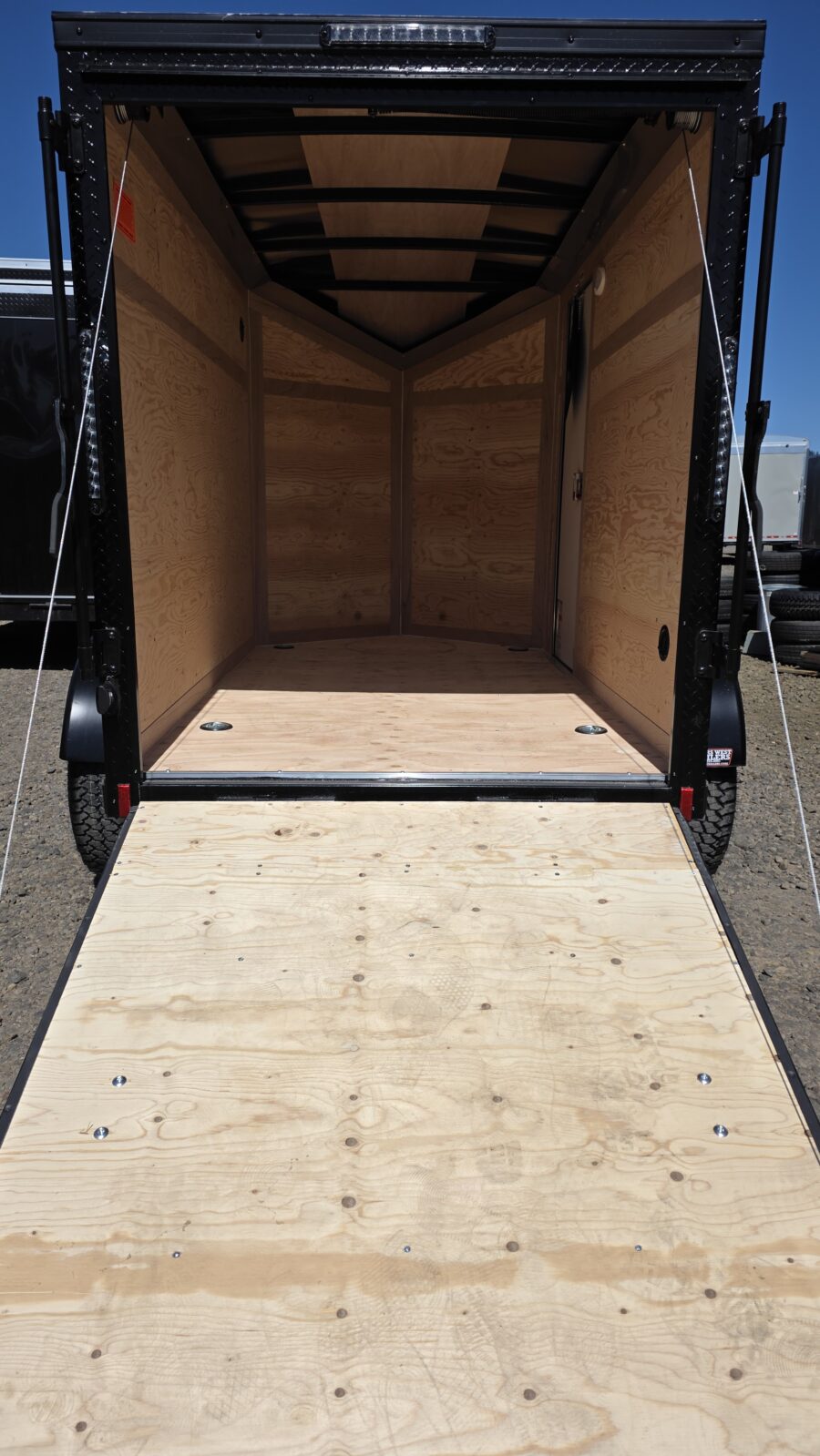 2026 Cargo Mate 5x8 E-Series Cargo Tailer 12" Extra Height Apex Tires Pure Black Straight Axle 4" Lift - Image 3